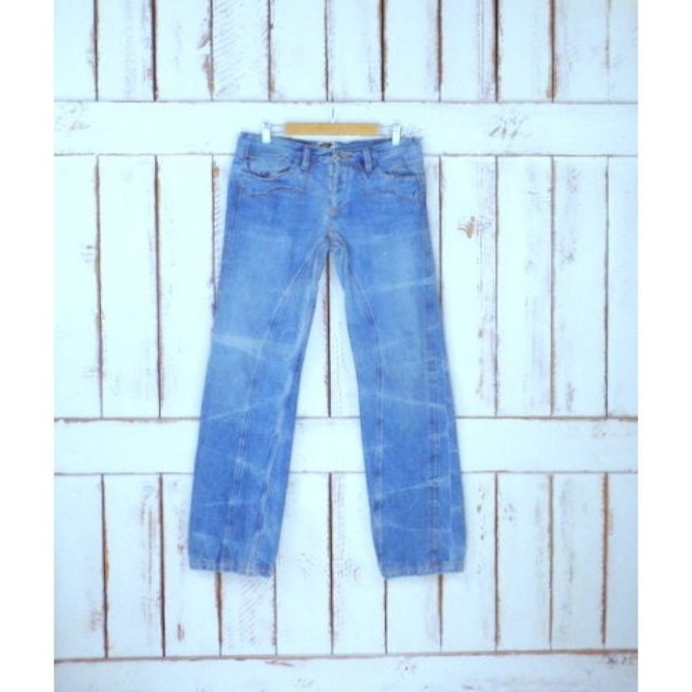Light blue bleached and faded boot cut denim embroidered jeans